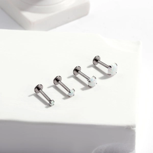 G23 titanium labret studs set with white opal stone inlay in four different sizes