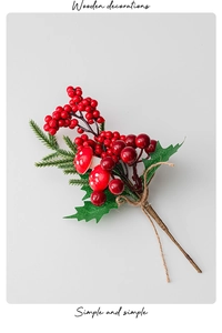 Detail of Christmas tree floral pick with red berries, mushrooms and pine needles
