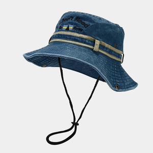 Close-up of blue denim sun hat featuring letter embroidery and adjustable wind rope