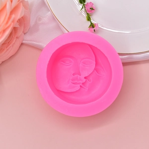 Pink silicone moon face mold for handmade soap, candles, and chocolate DIY crafts