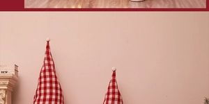 Detail of red and white plaid cone Christmas ornaments on a decorative indoor table