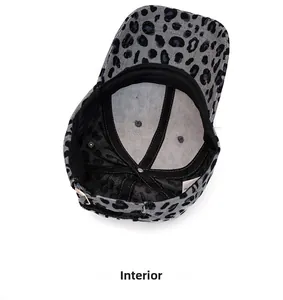 Internal view of leopard corduroy cap showing stitching, air holes and size adjuster