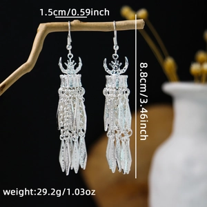 Detailed size view of silver vintage boho earrings with long fringe and hollow design