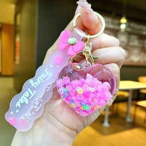 Llavero de corazón rosa con correa Fairy Tales y lentejuelas brillantes de colores