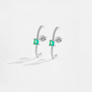 Detail view of S925 silver C-shape earrings with square green stone and pavé zircon settings