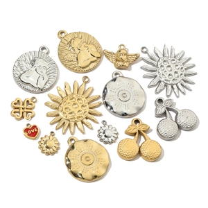 French geometric stainless steel charms with heart, clover, and angel designs in gold and silver