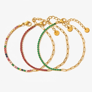 Detail of four gold-plated stainless steel bracelets featuring colorful zircon stones