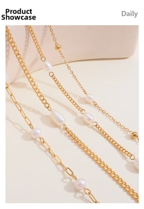 Detailed macro view of French freshwater pearls with 18k gold-plated stainless steel chains