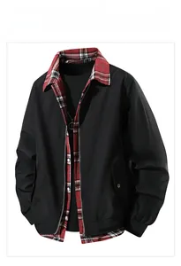 Detail of men's black jacket featuring plaid collar insert and silver zipper closure