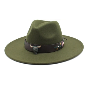 Detail of dark green fedora with leather band, bull skull buckle and floral embroidery