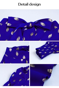 Detail view of the elegant blue blouse with gold polka dots and bow tie neckline