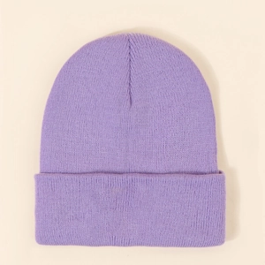 Detail of purple ribbed knit beanie showing soft texture and wide fold-over cuff