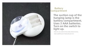 Detailed view of LED light battery box with suction cup for easy Christmas window mounting