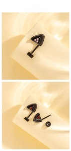 Detailed view of cat ear helix earrings with pink and red zircon stones and screw backs