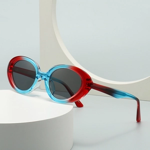 Retro cat-eye sunglasses with red and blue gradient frames and dark grey lenses