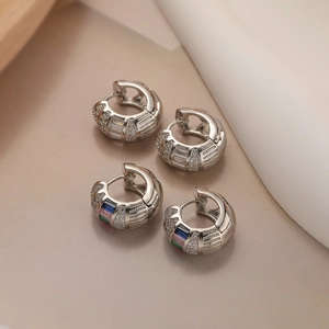 Detail of silver-plated hoop earrings with micro-pave crystals and colorful zircon stones