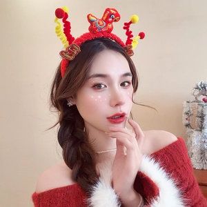 Detailed view of red plush lunar new year headband with zodiac dragon and Fu embroidery