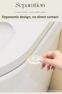 Close-up of a cream toilet lid lifter handle being used to open the seat cleanly