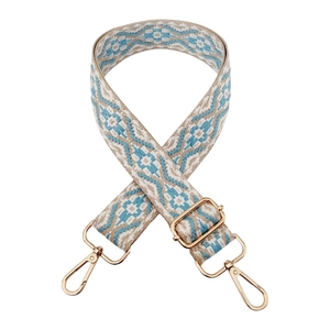 Close-up of bohemian geometric jacquard strap with polished gold-tone metal clasps