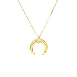 Gold moon horn necklace with pave zircon inlay on a minimalist white background