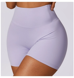 Detail of high-waisted seamless lavender yoga shorts showing fabric texture and firm fit