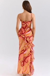 Detailed back view of abstract floral maxi dress with ruffle hem and backless tie design