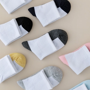 Detailed view of breathable mesh cotton socks for children with colorful ribbed knit cuffs