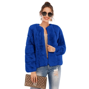 Detail view of the soft faux fur texture and crew neck design on this blue short jacket