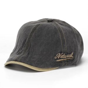Detail of vintage washed denim newsboy cap with Natural embroidery and khaki trim