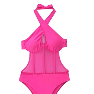 Hot pink one-piece halter swimsuit with mesh panels and crossover neckline detail