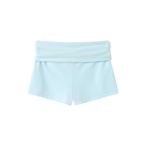 Close-up of light blue lace trim and rhinestone details on soft modal yoga shorts