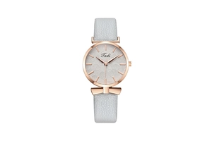 Detail of rose gold watch with leaf pattern dial, gray leather strap and bow ornament