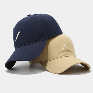 Classic cotton baseball caps in navy and khaki with minimalist diagonal slash embroidery