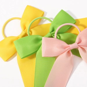 Chouchous avec nœuds en ruban gros-grain coloré pour filles en jaune et rose