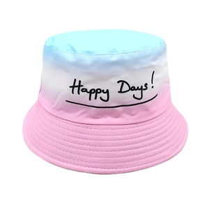 Detail showing gradient sky blue to pink bucket hat with Happy Days print for kids