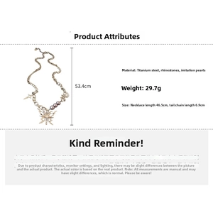 Detailed specs of lava butterfly necklace with rhinestones and faux pearls in gold