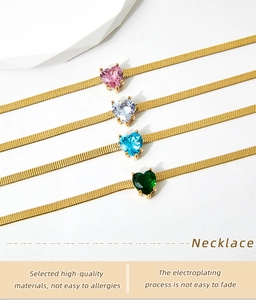 Detail view of heart-shaped zircon pendants in four colors on gold flat snake chains