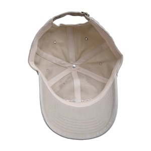 Detail showing inner cotton lining, sweatband and metal strap buckle on beige baseball cap