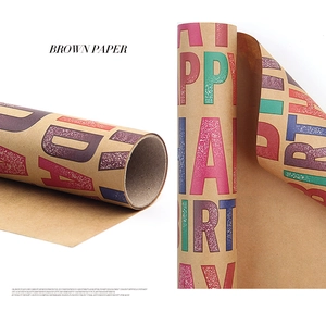 Macro detail of brown kraft wrapping paper roll with colorful Happy Birthday lettering