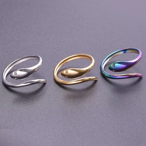 Detailed view of snake-shaped adjustable rings in silver, gold, and rainbow finish