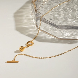 Polished gold stainless steel teardrop pendant necklace with OT toggle clasp design