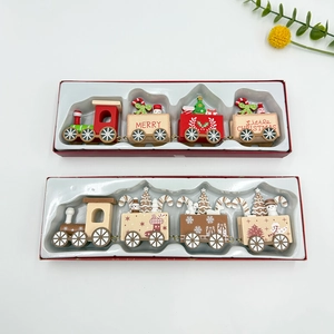 Detail view of four-car wooden Christmas train ornaments in festive gift packaging