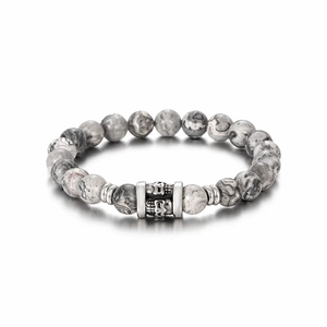 8mm natural grey stone beaded bracelet with metal skull charm on white background