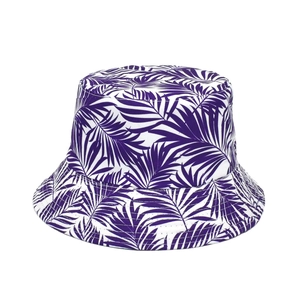 Double-sided reversible sun hat featuring a purple and white tropical palm leaf print
