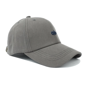 Detailed close-up of dark grey cotton baseball cap showing embroidery and fabric texture