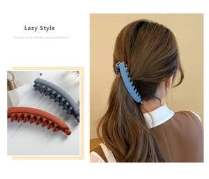 Detailed view of matte texture banana hair clip with secure comb structure for ponytail