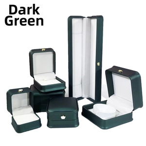 Dark green PU leather jewelry box set with gold crown buckle and white velvet lining