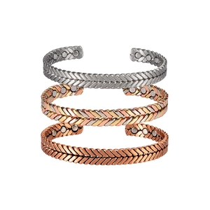 Three magnetic therapy braided copper bracelets in silver, tricolor and copper finishes