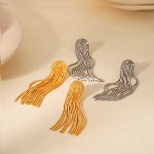 Close-up of gold and silver long chain tassel earrings in 18K plated stainless steel