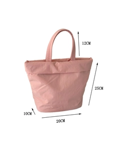 Detailed dimensions of the pink puffy nylon handbag with size markings on white background